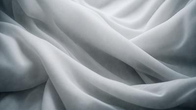 The primary subject of the image is a white sheet of fabric, which is the main object, scene, or focus of the image. The setting or background consists of a white surface, which could be a wall or a table. The visual style of the image is a close-up of the white sheet, showcasing its texture and details. The colors and mood of the image are predominantly white, giving it a clean and minimalist appearance.