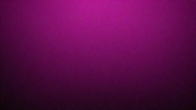The primary subject of the image is a purple wall. The setting is a room with a purple wall, and the visual style is a close-up of the wall. The dominant colors are purple, and the overall atmosphere is calm and serene.