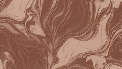 The primary subject of the image is a brown and white marbled paper with a swirling pattern. The setting is a table, and the visual style is a close-up of the paper. The colors and mood of the image are warm and earthy, with the brown and white marbled paper creating a sense of depth and texture.