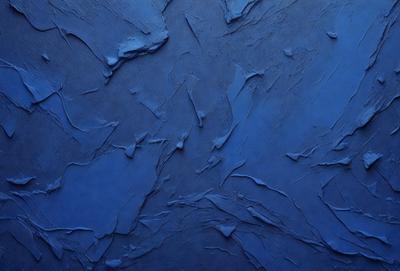 The primary subject of the image is a blue wall with a textured surface. The setting is a room with a blue background. The visual style is a close-up of the blue wall, which gives a sense of depth and texture. The dominant colors are blue and grey, creating a calm and soothing atmosphere.