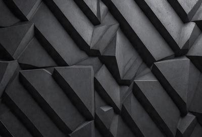 The primary subject of the image is a black and white patterned wall. The setting is a dark room, and the visual style appears to be a combination of a photo and a digital art or illustration. The dominant colors are black and white, creating a moody atmosphere.