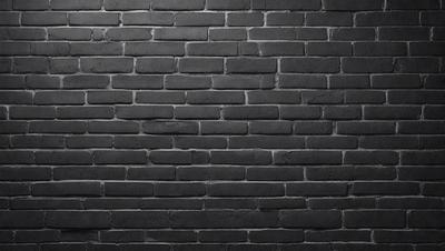 The primary subject of the image is a brick wall. The setting is a black and white photo, which gives the image a classic and timeless appearance. The visual style is a close-up of the brick wall, emphasizing its texture and details. The colors and mood of the image are predominantly black and white, creating a sense of depth and contrast.