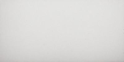 The primary subject of the image is a white wall. The setting is a plain, empty room with no other objects or people visible. The visual style is a simple, clean, and minimalist design. The colors and mood are predominantly white, creating a calm and serene atmosphere.