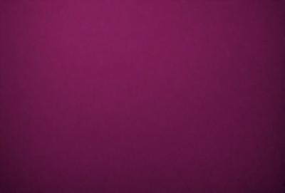 The primary subject of the image is a purple wall. The setting is a room with a purple wall, and the visual style is a close-up of the wall. The dominant colors are purple, and the overall atmosphere is calm and serene.