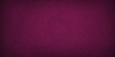 The primary subject of the image is a purple circular pattern, which appears to be a piece of fabric or a decorative item. The setting is a purple background, which complements the circular pattern. The visual style is a close-up of the circular pattern, showcasing its intricate details. The colors and mood of the image are predominantly purple, creating a calm and serene atmosphere.