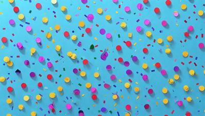 The primary subject of the image is a blue wall with a pattern of colorful confetti, including yellow, pink, and purple. The setting is a room with a blue background, and the visual style appears to be a digital art or illustration. The dominant colors and overall atmosphere are vibrant and lively, creating a festive and cheerful mood.