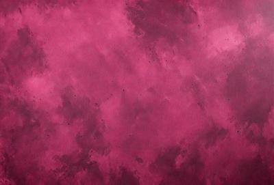 The primary subject of the image is a pink background with a cloudy sky. The setting is a cloudy sky, and the visual style is a photo. The dominant colors are pink and purple, creating a warm and calming atmosphere.