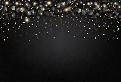 The primary subject of the image is a close-up of a black background with a pattern of gold confetti. The setting is a dark background, and the visual style is a pattern of gold confetti. The colors and mood of the image are predominantly black and gold, creating a sophisticated and elegant atmosphere.