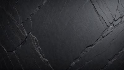 The primary subject of the image is a black stone wall. The setting is a dark room, and the visual style is a close-up of the stone wall. The colors and mood of the image are predominantly dark, with the black stone wall being the main focus.