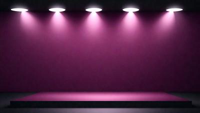 The primary subject of the image is a purple wall with three lights shining on it. The setting is a room with a purple wall, and the visual style is a photo. The dominant colors are purple and pink, creating a warm and inviting atmosphere.