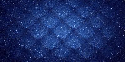 The primary subject of the image is a blue starry background. The setting is a dark, star-filled sky, with the stars being the main objects in the scene. The visual style is a digital art or illustration, as the background is a pattern of blue stars. The colors and mood of the image are predominantly blue, with a sense of wonder and awe due to the vastness of the starry sky.