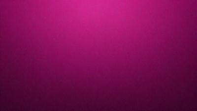 The primary subject of the image is a close-up of a pink surface. The setting is a pink background, and the visual style appears to be a photo. The dominant colors in the image are pink, and the overall atmosphere is warm and inviting.