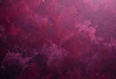 The primary subject of the image is a purple wall with a pattern of circles. The setting is a room with a purple wall, and the visual style is a close-up of the wall. The dominant colors are purple and red, creating a warm and inviting atmosphere.