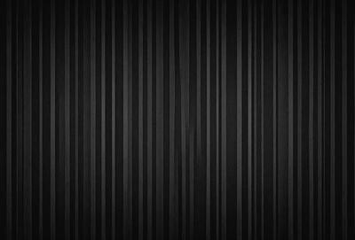 The primary subject of the image is a black and white striped pattern. The setting is a black background, and the visual style is a pattern. The dominant colors are black and white, and the overall atmosphere is bold and striking.