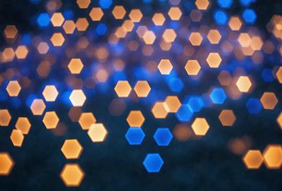 The primary subject of the image is a blue background with a pattern of bright, glowing dots. The dots are scattered throughout the background, creating a visually striking and vibrant scene. The visual style of the image is a combination of a photo and digital art, as the dots appear to be a part of a larger design or pattern. The colors and mood of the image are predominantly blue and bright, with the glowing dots adding a sense of energy and liveliness to the scene.