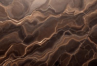 The primary subject of the image is a close-up of a marble countertop. The setting is a kitchen, with the countertop being the main focus of the scene. The visual style is a photo, capturing the natural texture and patterns of the marble. The colors and mood of the image are warm and inviting, with the marble countertop being the main source of visual interest.