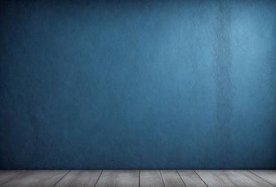 The primary subject of the image is a blue wall with a wooden floor. The setting is a room with a blue wall and a wooden floor. The visual style is a photo, and the dominant colors are blue and white. The overall atmosphere is calm and serene.