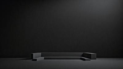 The primary subject of the image is a bench, which is the main object in the scene. The setting is a black background, which creates a dramatic and moody atmosphere. The visual style is a photo, capturing the bench in its surroundings. The colors in the image are predominantly black, giving the scene a dark and mysterious mood.