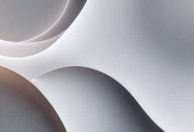 The primary subject of the image is a large white sheet of paper. The setting is a room with a white background, and the visual style appears to be a photo. The colors and mood of the image are predominantly white, giving it a clean and minimalist appearance.