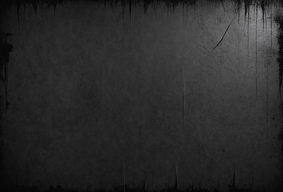 The primary subject of the image is a black background with a white line. The setting is a dark room, and the visual style is a black and white photo. The colors and mood of the image are dark and moody, creating a dramatic atmosphere.