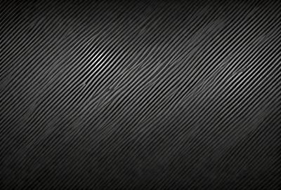 The primary subject of the image is a black and white patterned background. The setting is a dark background, which creates a moody atmosphere. The visual style is a patterned background, which adds a unique and artistic touch to the image. The colors and mood are predominantly dark and dramatic, with the black and white pattern creating a sense of depth and contrast.