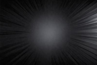 The primary subject of the image is a black background with a white circle in the center. The setting is a dark room, and the visual style is a close-up of the white circle. The colors and mood of the image are predominantly black and white, creating a stark and dramatic atmosphere.