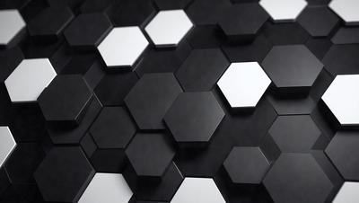 The primary subject of the image is a close-up of a black and white patterned surface. The setting appears to be a black background, which contrasts with the patterned surface. The visual style of the image is a combination of a photo and digital art, creating a unique and intriguing pattern. The colors and mood of the image are predominantly black and white, giving it a classic and timeless feel.