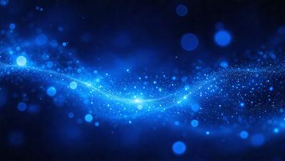 The primary subject of the image is a blue background with a swirling pattern of blue lights. The setting appears to be a dark space, possibly a night sky or a dark room. The visual style of the image is digital art, as it features a computer-generated pattern of blue lights. The colors and mood of the image are predominantly blue, creating a serene and calming atmosphere.