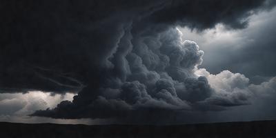 The primary subject of the image is a cloudy sky with dark clouds and a stormy atmosphere. The setting is a field with a dark sky looming over it. The visual style is a black and white photo, which adds a dramatic and moody effect to the scene. The colors and mood of the image are predominantly dark and ominous, creating a sense of tension and anticipation.