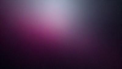 The primary subject of the image is a purple background. The setting is a dark, foggy environment, creating a moody atmosphere. The visual style is a close-up of the purple background, which appears to be a pattern or texture. The colors and mood of the image are predominantly purple, with a hint of darkness, giving it a mysterious and intriguing appearance.