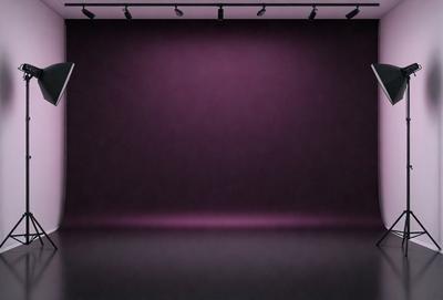 The primary subject of the image is a purple curtain, which is the main object in the scene. The setting is a stage or a theater, with a purple background visible. The visual style is a photo, capturing the purple curtain in its natural environment. The colors and mood of the image are predominantly purple, creating a dramatic and theatrical atmosphere.