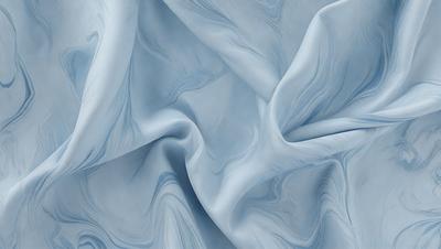 The primary subject of the image is a blue fabric, which appears to be a piece of cloth or a sheet. The setting is a blue background, which complements the blue fabric. The visual style is a close-up of the fabric, showcasing its texture and details. The colors and mood of the image are predominantly blue, creating a calm and serene atmosphere.