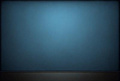 The primary subject of the image is a blue wall. The setting is a dark room, and the visual style is a photo. The dominant colors are blue and black, creating a calm and serene atmosphere.