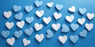 The primary subject of the image is a collection of white hearts arranged on a blue background. The hearts are of various sizes and are placed in a visually appealing manner. The setting is a blue wall, which serves as the backdrop for the hearts. The visual style of the image is a combination of digital art and illustration, creating a clean and modern appearance. The dominant colors are white and blue, giving the image a calm and serene atmosphere.