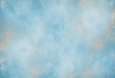 The primary subject of the image is a blue sky with clouds. The setting is a cloudy sky, and the visual style is a photo. The dominant colors are blue and white, creating a calm and serene atmosphere.