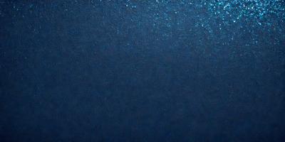 The primary subject of the image is a large body of blue water. The setting is a vast expanse of water, with no visible land or other objects. The visual style is a close-up of the water, showcasing its depth and beauty. The colors and mood of the image are predominantly blue, creating a serene and calming atmosphere.