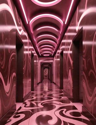 The primary subject of the image is a hallway with a pink color scheme. The setting is a long, narrow hallway with a patterned wall. The visual style is a combination of a photo and digital art, creating a unique and artistic atmosphere. The colors and mood are predominantly pink, giving the space a warm and inviting feel.