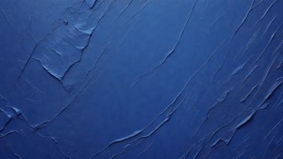The primary subject of the image is a blue surface, which appears to be a wall or a piece of artwork. The setting is a room with a blue background, and the visual style is a close-up of the blue surface. The colors and mood of the image are predominantly blue, creating a calm and serene atmosphere.