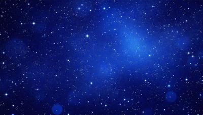 The primary subject of the image is the night sky filled with stars. The setting is a dark, star-filled sky, and the visual style is a photo of the night sky. The colors and mood of the image are predominantly dark and serene, with the stars providing a sense of wonder and tranquility.
