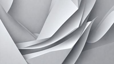 The primary subject of the image is a large, folded piece of paper. The paper is gray and appears to be made of cardboard. The setting is a room with a gray background, which adds to the overall atmosphere of the image. The visual style is a close-up of the folded paper, showcasing its texture and details. The colors and mood of the image are predominantly gray, giving it a calm and minimalistic appearance.