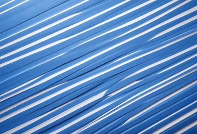 The primary subject of the image is a blue and white striped pattern. The setting is a white wall, and the visual style appears to be a digital art or illustration. The dominant colors are blue and white, creating a calm and soothing atmosphere.