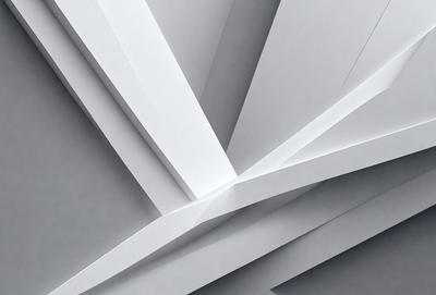 The primary subject of the image is a white paper or cardboard, which is the main object, scene, or focus of the image. The setting or background consists of a gray wall, which provides a contrasting backdrop for the paper. The visual style of the image is a close-up of the paper, showcasing its texture and details. The colors and mood of the image are predominantly white, giving it a clean and minimalist appearance.