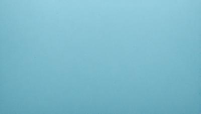 The primary subject of the image is a large, empty blue sky. The setting is a vast, open space with no visible landmarks or objects. The visual style is a natural, untouched landscape. The colors and mood are predominantly blue, creating a serene and peaceful atmosphere.