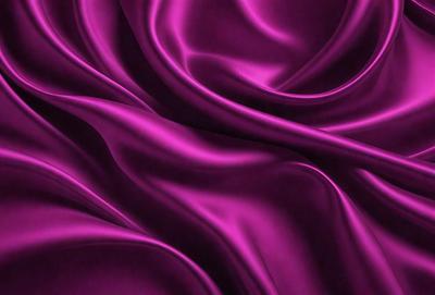 The primary subject of the image is a purple fabric, which is the main object, scene, or focus of the image. The setting or background is a purple curtain, and the visual style is a close-up of the purple fabric. The colors and mood of the image are predominantly purple, creating a calm and serene atmosphere.