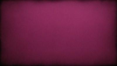 The primary subject of the image is a large, pink wall. The setting is a room with a pink background, and the visual style is a close-up of the wall. The dominant colors in the image are pink, and the overall atmosphere is warm and inviting.