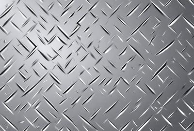The primary subject of the image is a close-up of a metal surface, possibly a piece of metal or a metal wall. The setting is a gray background, which contrasts with the metal surface. The visual style appears to be a photo or a digital artwork, as the metal surface is captured in detail. The colors in the image are predominantly gray, which gives the scene a somewhat industrial or metallic atmosphere.