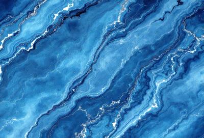 The primary subject of the image is a blue and white marble pattern. The setting is a blue and white marble surface, which serves as the background. The visual style is a close-up of the marble pattern, showcasing its intricate details. The colors and mood of the image are predominantly blue and white, creating a sense of elegance and sophistication.