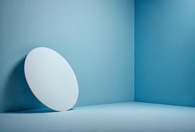 The primary subject of the image is a white, round, flat object, which appears to be a frisbee or a plate. The setting is a blue wall, which serves as the backdrop for the object. The visual style of the image is a photo, capturing the white frisbee or plate in its natural environment. The colors and mood of the image are predominantly blue, creating a calm and serene atmosphere.