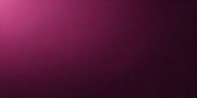 The primary subject of the image is a large, purple wall. The setting is a room with a pink background. The visual style is a close-up of the wall, showcasing its color and texture. The dominant colors are purple and pink, creating a warm and inviting atmosphere.