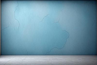 The primary subject of the image is a blue wall with a cracked and chipped appearance. The setting is a room with a concrete floor. The visual style is a drawing or illustration, giving the wall a textured and aged look. The dominant colors are blue and white, creating a calm and soothing atmosphere.